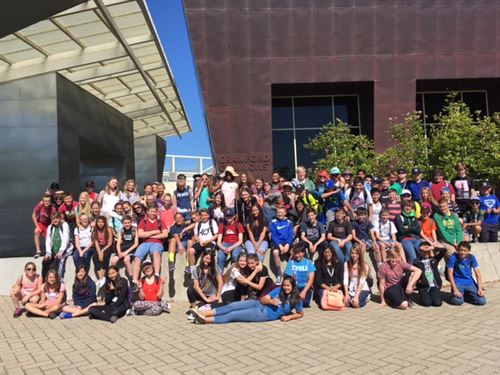 class photo outdoors in front of building